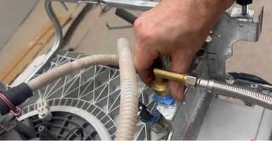 Fitting a new drain hose to a washing machine